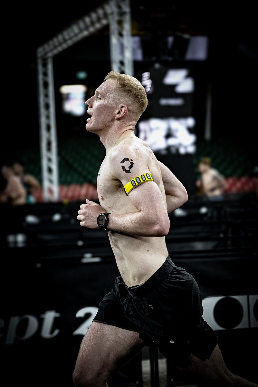 Liam McCroary racing HYROX in the Performr band